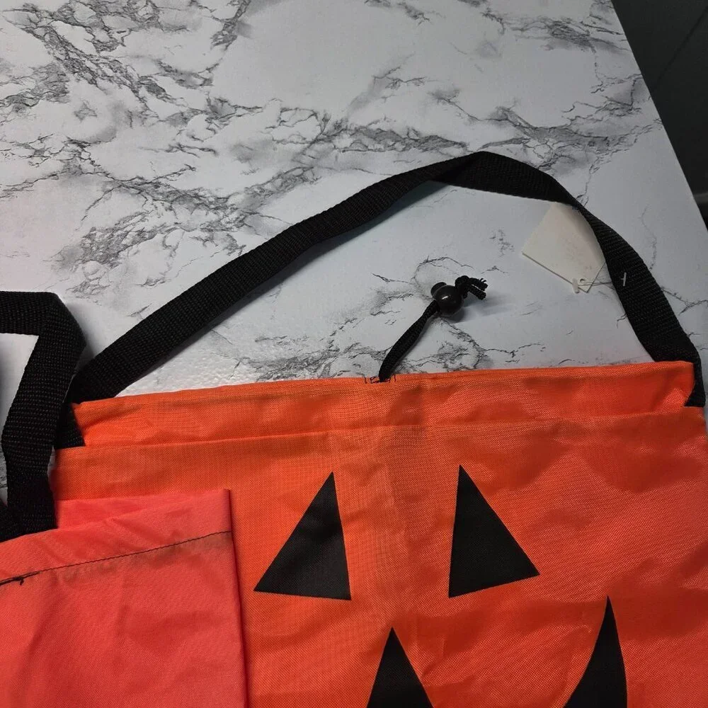 Bright Orange Pumpkin Face Drawstring Handle Trick or Treat Bags ( Set of 2 )
